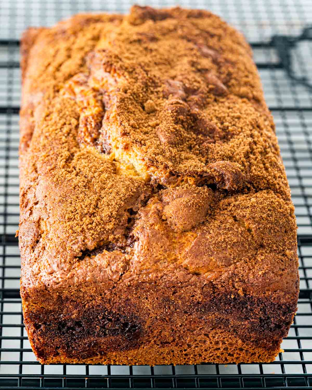freshly baked coffee cake bread on a cooling rack.