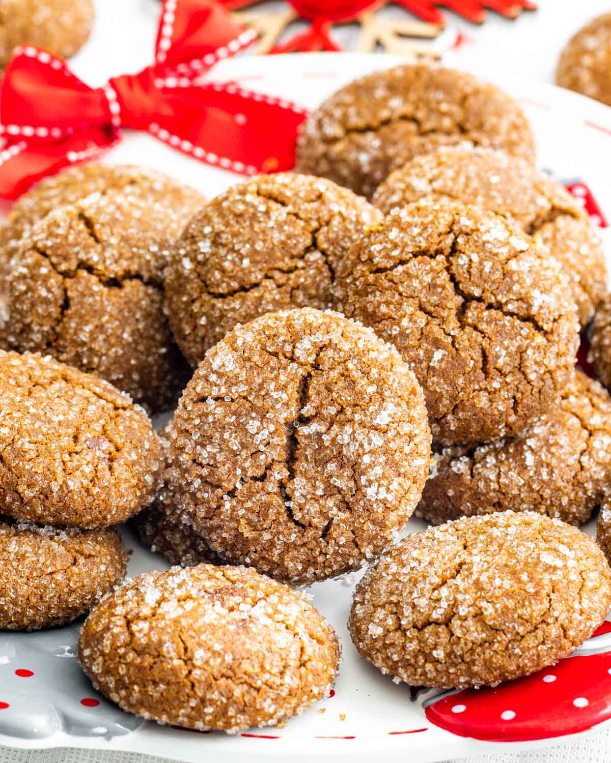 closeups of gingersnaps cookies piled together.