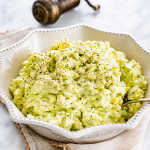 side view shot of a bowl full of avocado egg salad