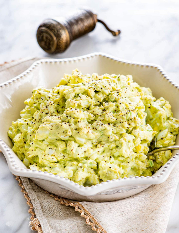 side view shot of a bowl full of avocado egg salad