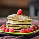 a stack of the biggest loser pancakes garnished with fresh raspberries