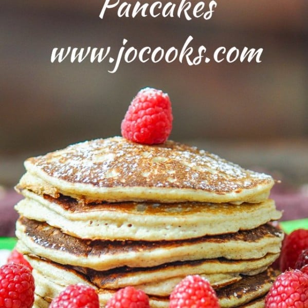 a stack of the biggest loser pancakes topped with fresh raspberries