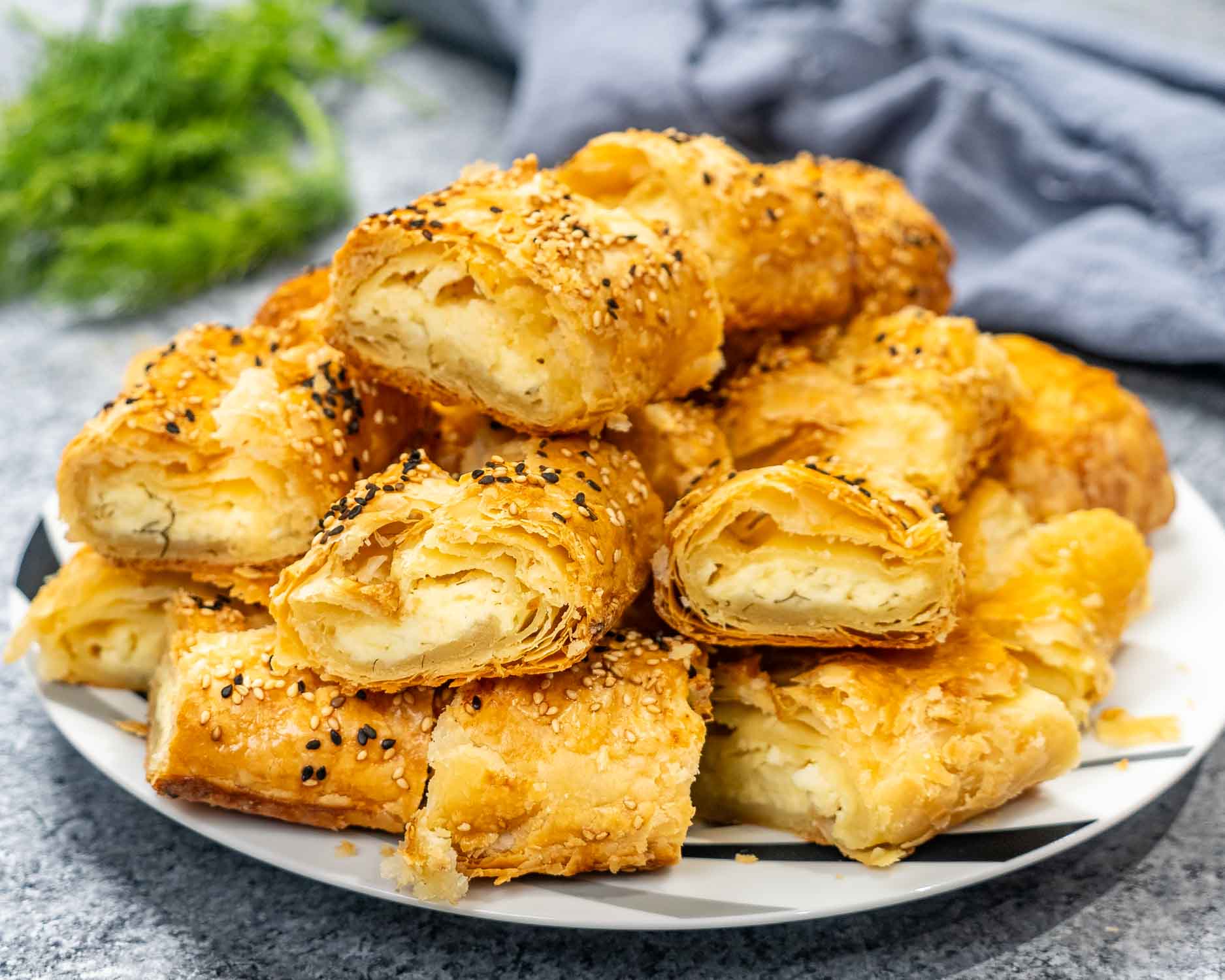 a bunch of cheese pie slices on a plate.