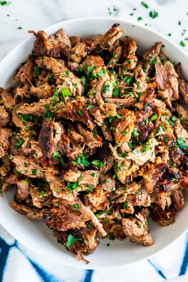 overhead shot of a bowl full of pork carnitas