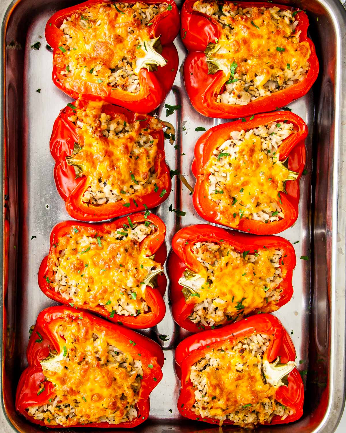 overhead shot of fresh out of the oven stuffed peppers in a casserole dish