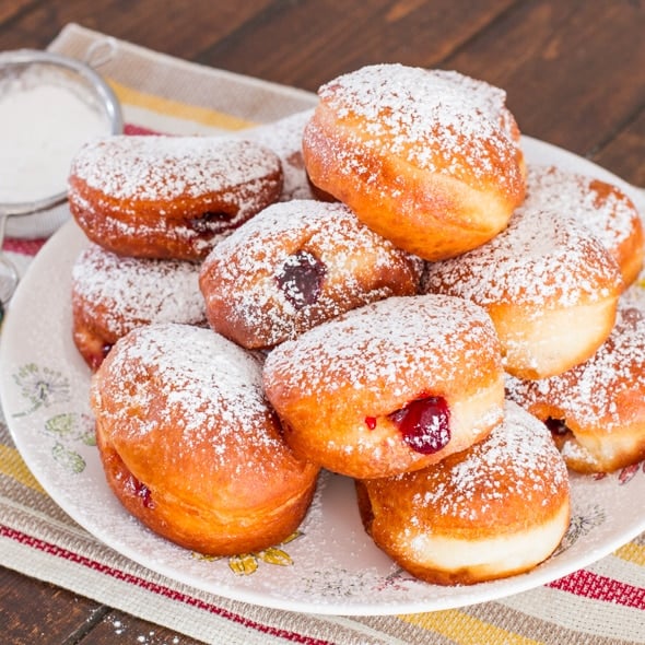 Cherry Jam Filled Sour Cream Donuts dusted with powdered sugar