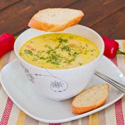 a bowl of soup a la grec with two slices of bread