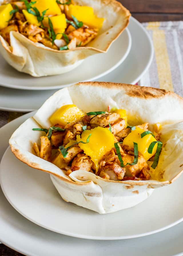 Chicken and Mango Tortilla Bowls with a delicious and refreshing cabbage slaw. A healthy lunch that's sure to impress your guests.