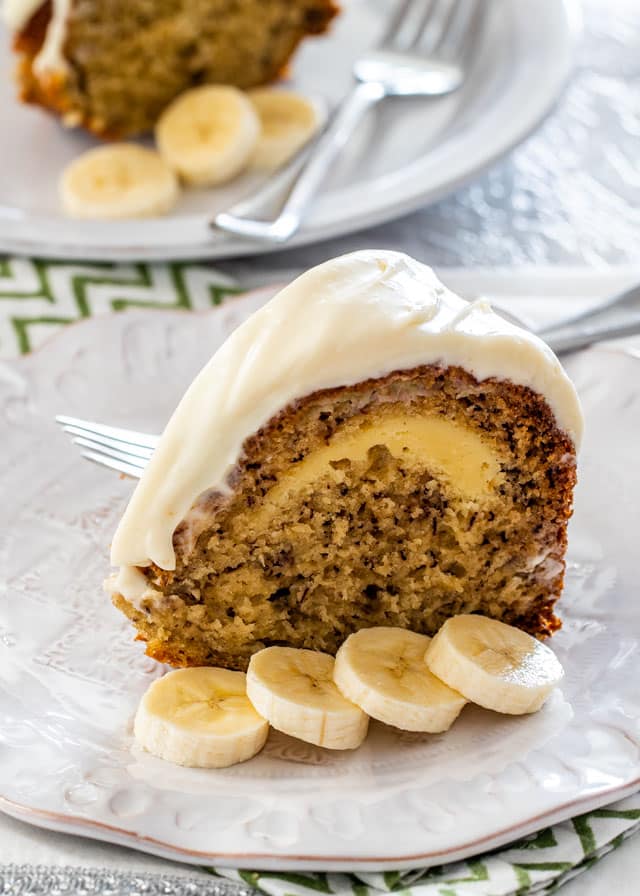 a slice of Cream Cheese Filled Banana Cake on a white plate