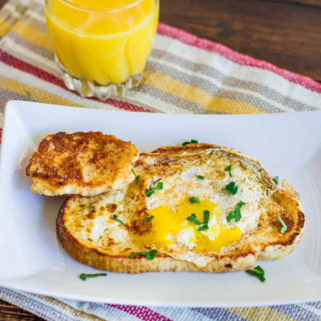 French Toasted Egg In a Hole – easy and fun to make breakfast with your kids. Take your traditional French toast, make a hole in the middle and add an egg.