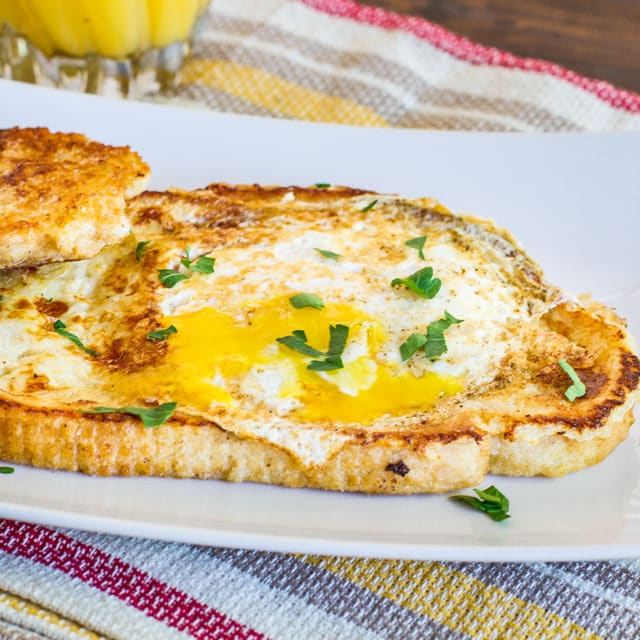 French Toasted Egg In a Hole – easy and fun to make breakfast with your kids. Take your traditional French toast, make a hole in the middle and add an egg.