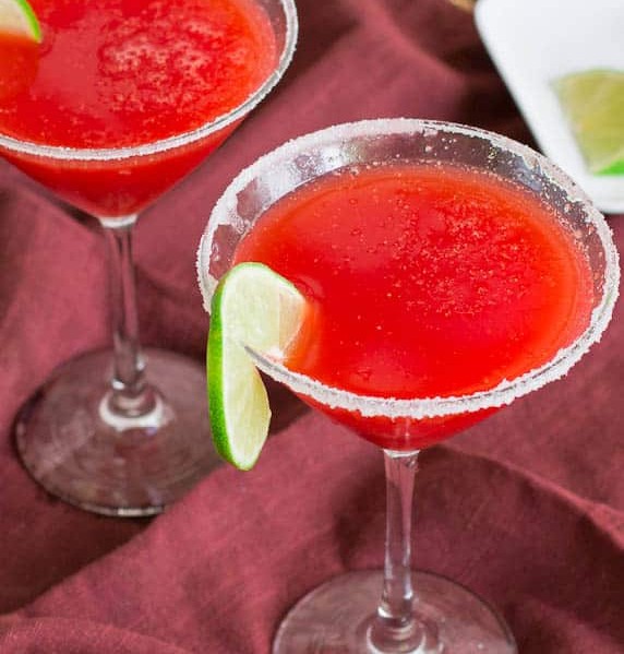 two strawberry margaritas in martini glasses