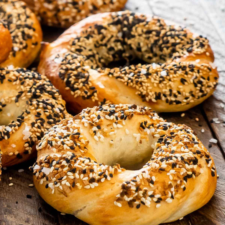 freshly baked bagels topped with sesame seeds.