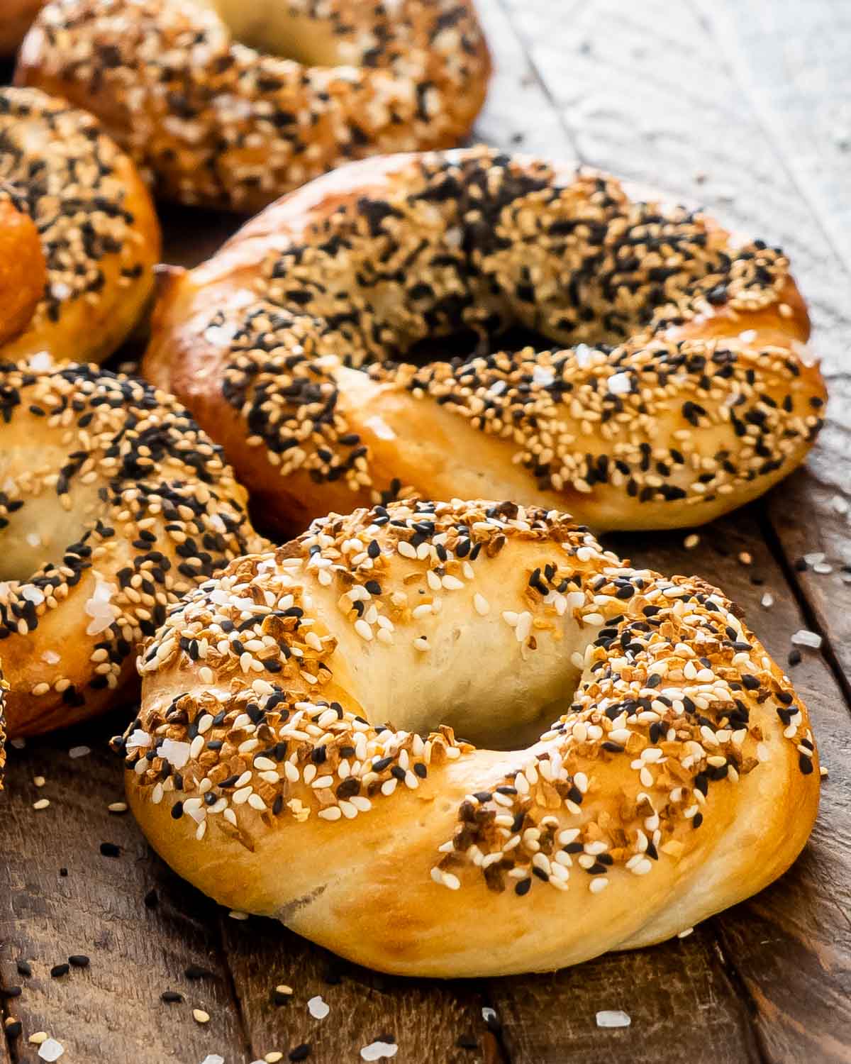 freshly baked bagels topped with sesame seeds.