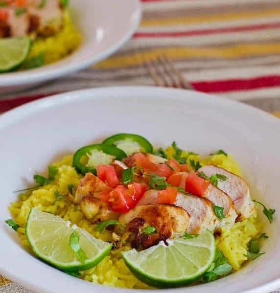 a bowl of cilantro lime rice topped with tequila lime chicken