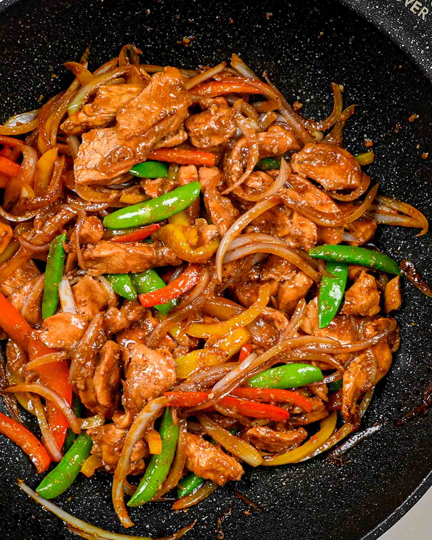 freshly made oyster sauce chicken in a wok.