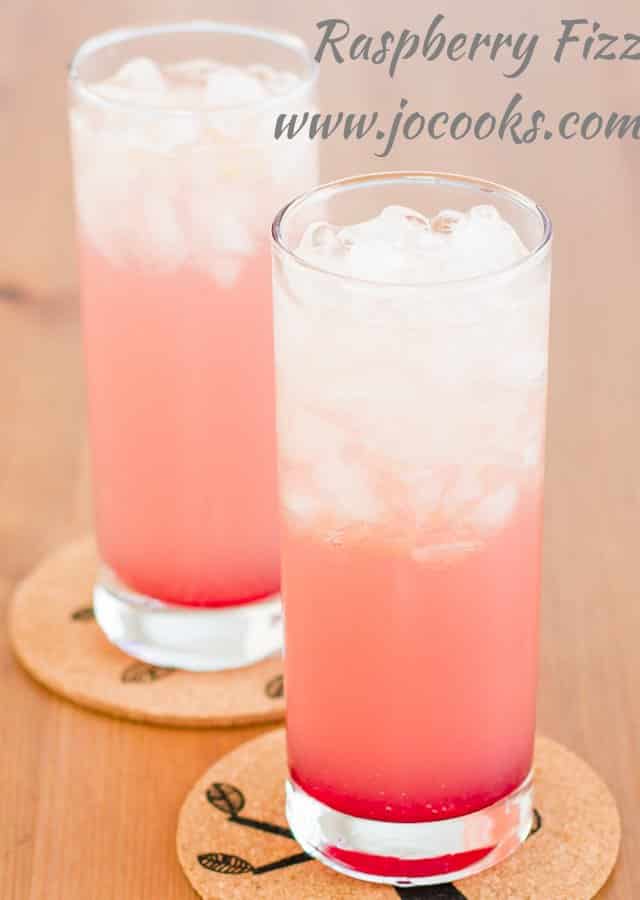 Close up shot of 2 tall glasses of Raspberry Fizz