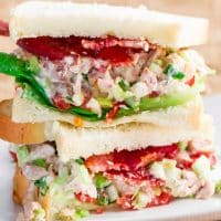 easy chicken salad sandwich halves stacked on a plate