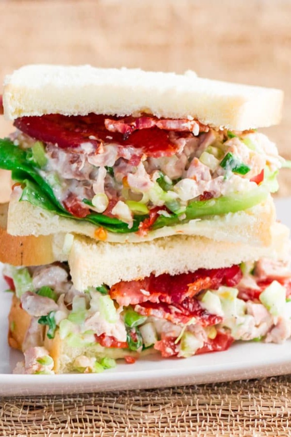 easy chicken salad sandwich halves stacked on a plate
