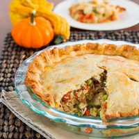 chicken pot pie with a slice taken out of it