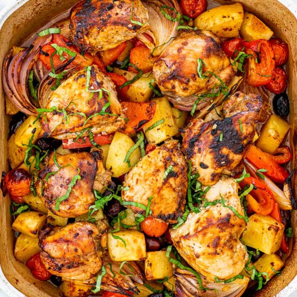 overhead shot of roasted chicken and vegetables in a pan