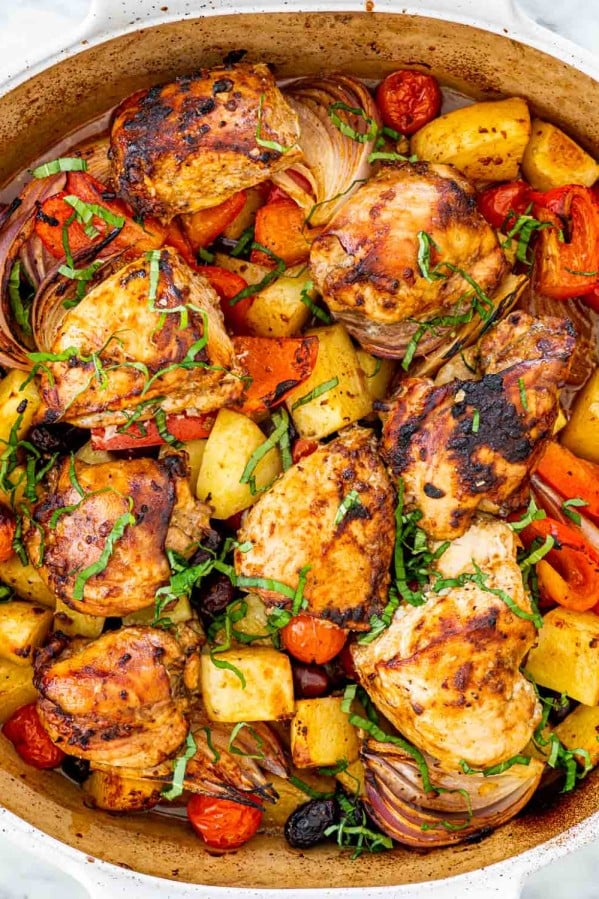 overhead shot of roasted chicken and vegetables in a pan