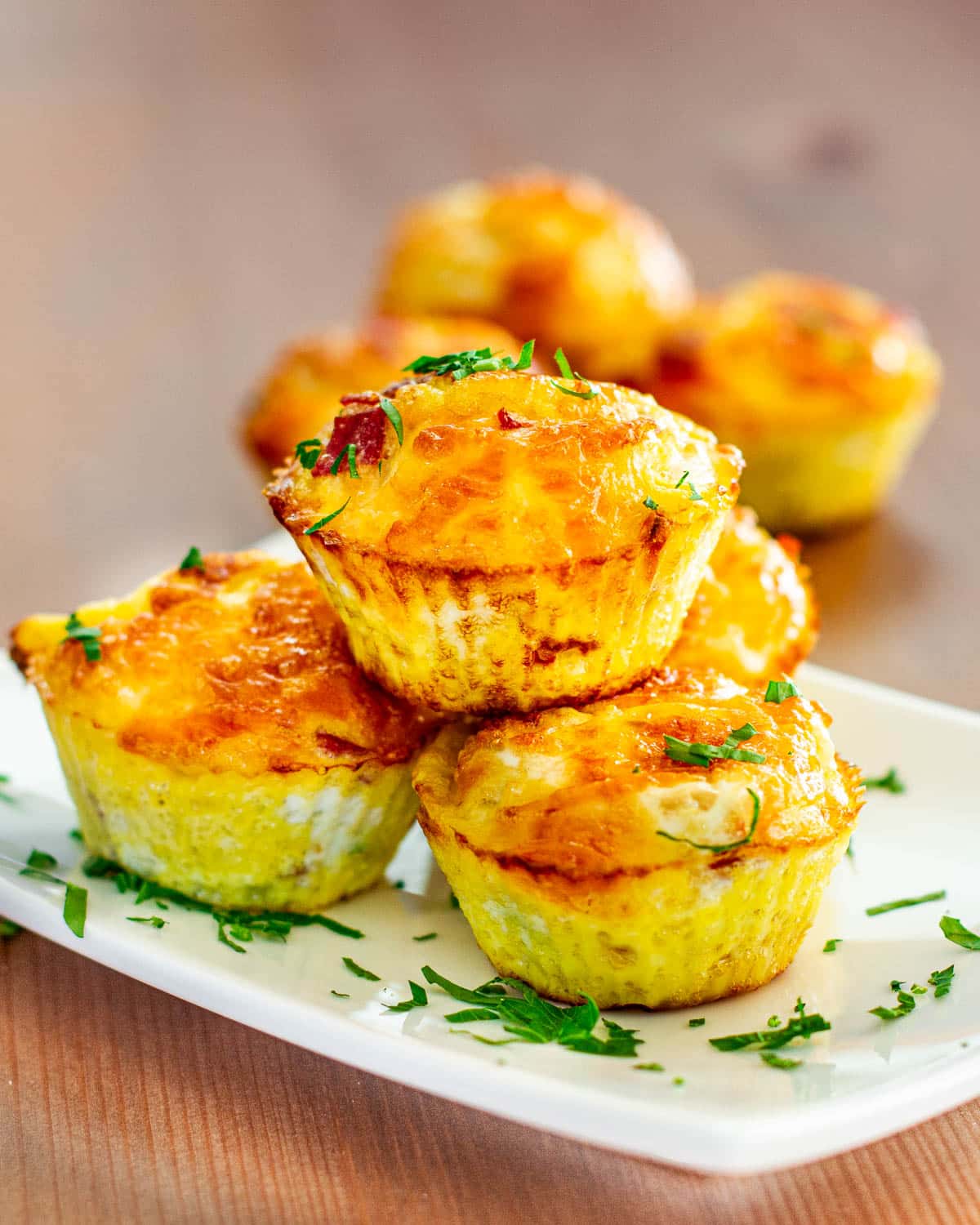 a stack of egg muffins on a white plate 