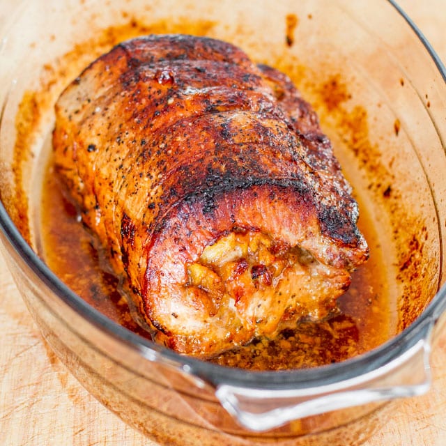 Caramelized Pork Loin stuffed with caramelized apples in a baking dish