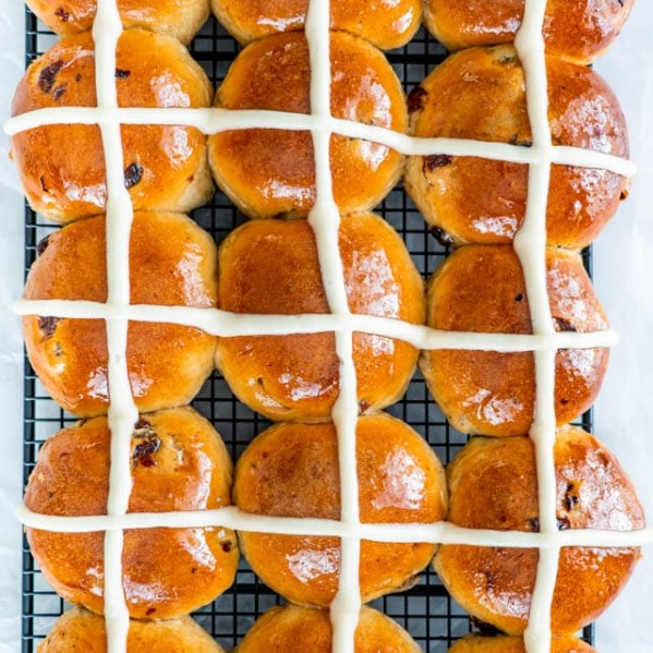overhead shot of hot cross buns on a cooling rack