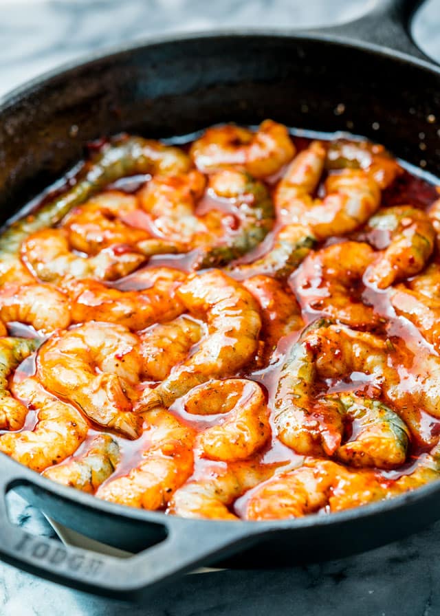 Spicy New Orleans Shrimp in a skillet ready to go in the oven