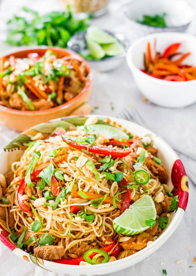 Crockpot Chinese Pork with Noodles in a plate garnished with lime