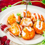 a plate of buffalo chicken meatballs with blue cheese dressing