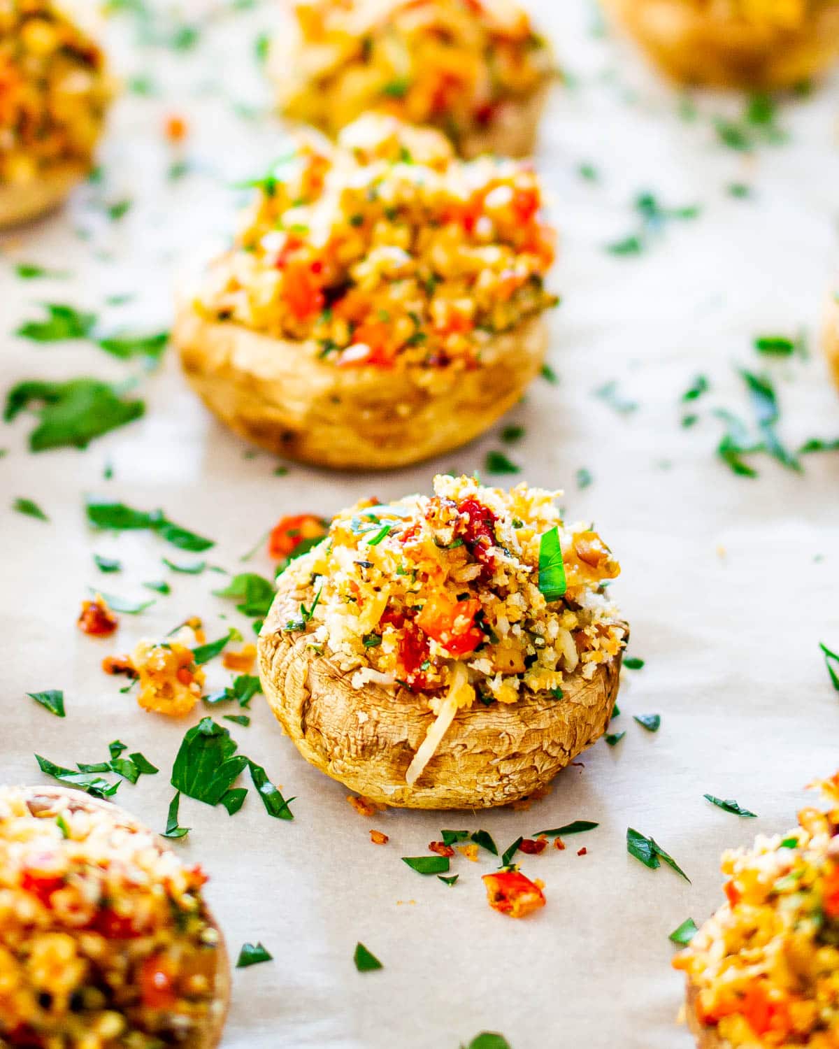 close up of a freshly baked stuffed mushroom garnished with parsley