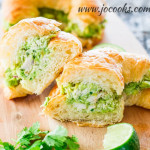 avocado chicken croissant cut in half exposing the center
