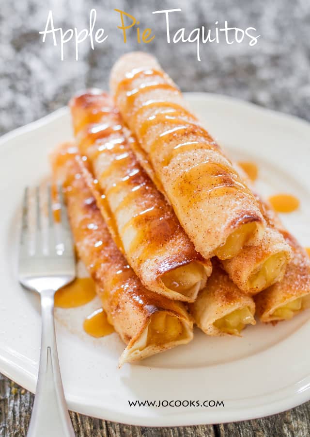 a plate with a stack of 6 apple pie taquitos drizzled with caramel sauce