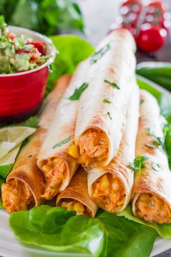 a pyramid stack of cheesy chicken flautas