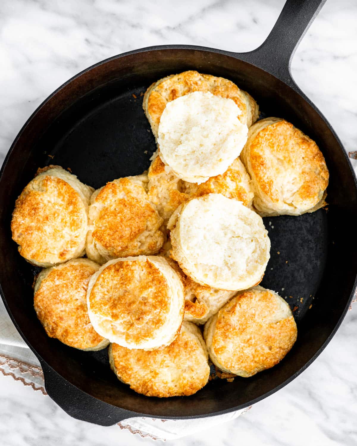 overhead shot of buttermilk biscuits in a skillet