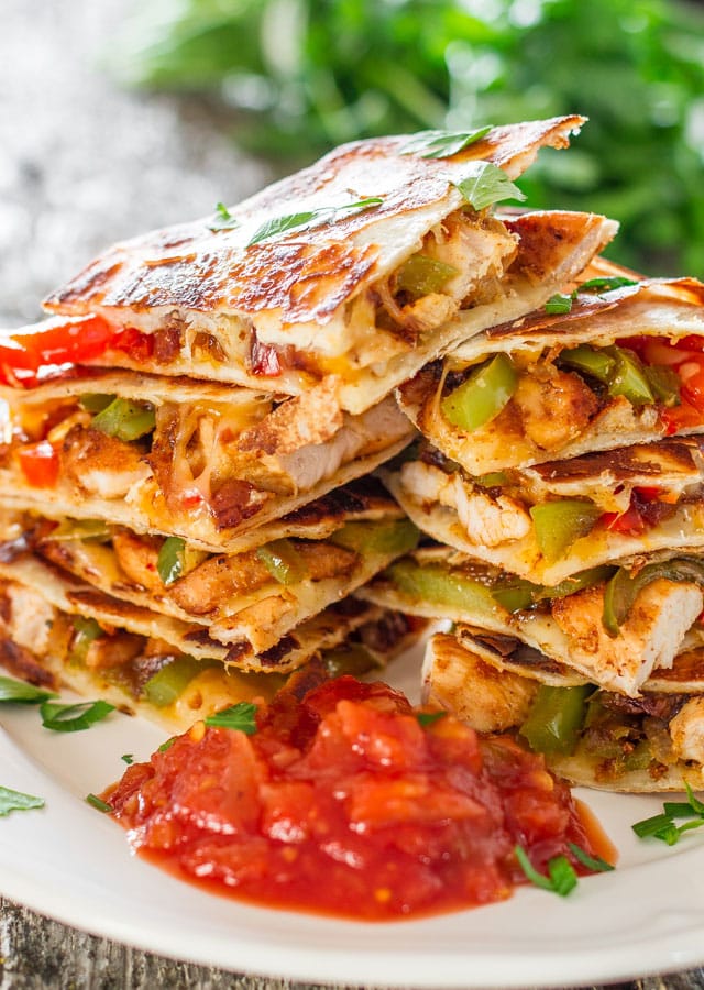 Chicken Fajita Quesadillas - sauteed onions, red and green peppers, perfectly seasoned chicken breast, melted cheese, between two tortillas. Simply yummy.