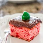 a slice of chocolate cherry sheet cake on a plate