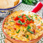 spicy cheese and corn tomato dip in a bowl