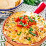 spicy cheese and corn tomato dip in a bowl