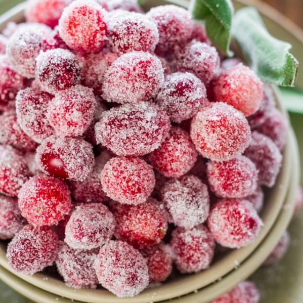 a bowl full of sugar coated cranberries