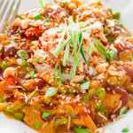 a bowl full of bang bang chicken and shrimp