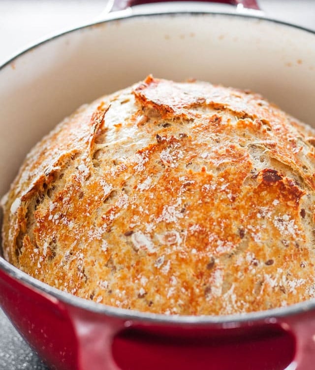 a freshly baked loaf of bread in a dutch oven