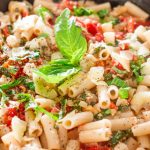 a pot full of tomato basil and spinach penne