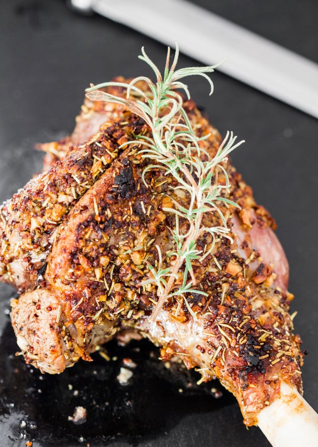 Rosemary and Garlic Roasted Leg of Lamb with a sprig of rosemary
