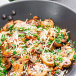 sauteed garlic and parmesan mushrooms in a skillet