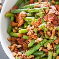 a bowl of green beans and chanterelle mushrooms