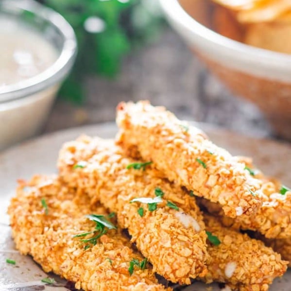 oven fried breaded chicken tenders on a plate