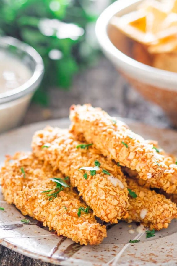 oven fried breaded chicken tenders on a plate
